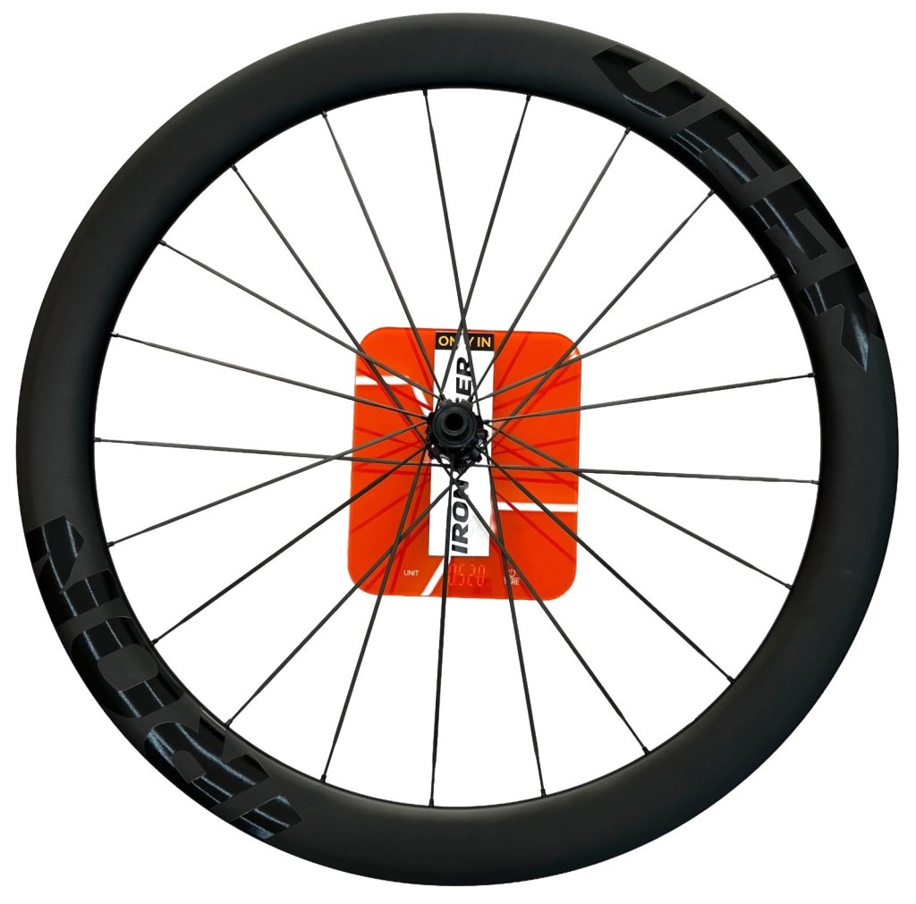 IronDeer R50 SL carbon road rear wheel on a workshop scale.